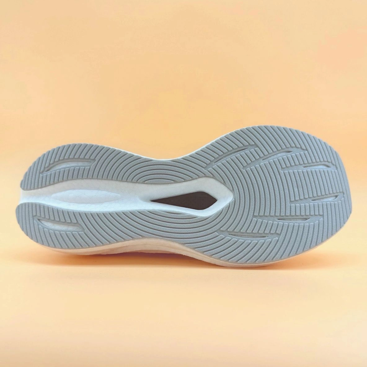 Sneaker sole with intricate tread pattern.