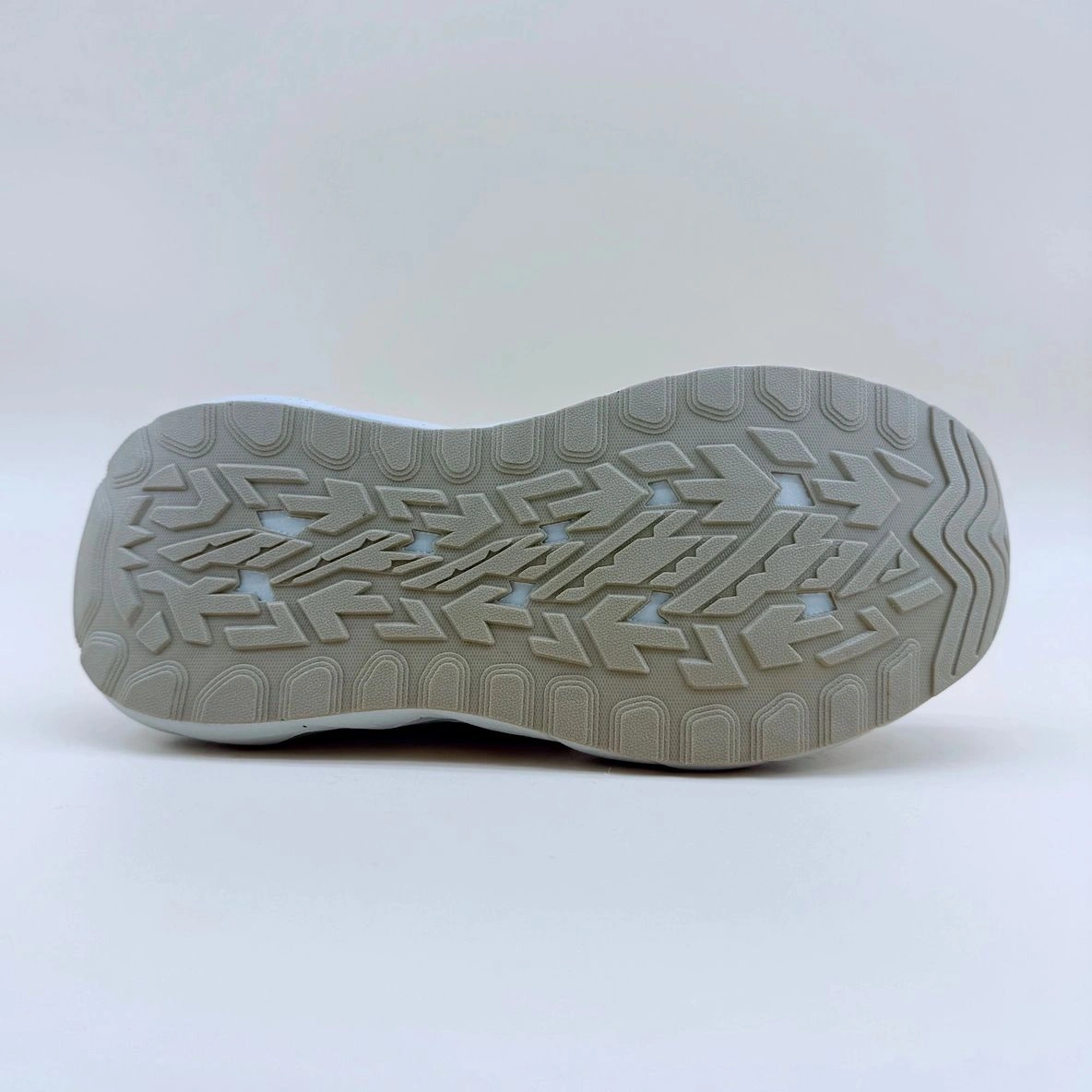 Sneaker sole with textured tread pattern.