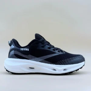 Black and white athletic shoe, side view.