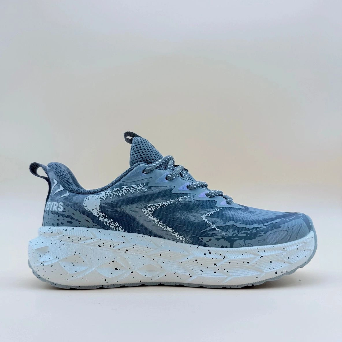 Blue and white athletic shoe with pattern.