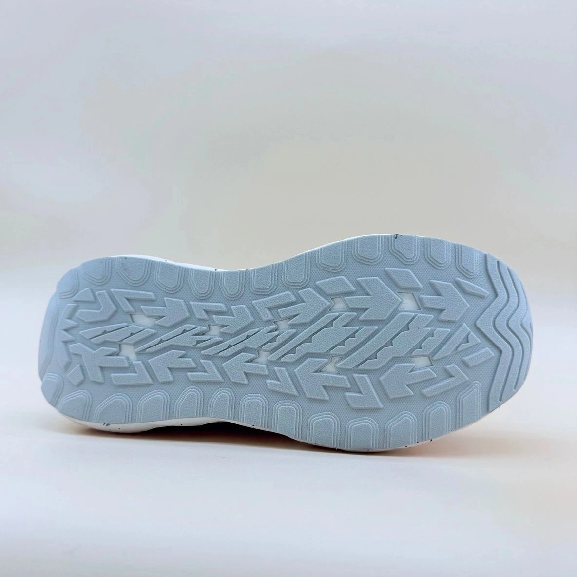 Sneaker sole with geometric tread pattern.